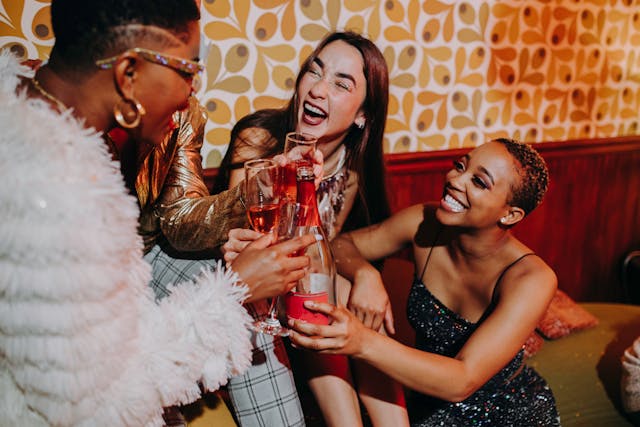 A group of women talking and having fun at a party.